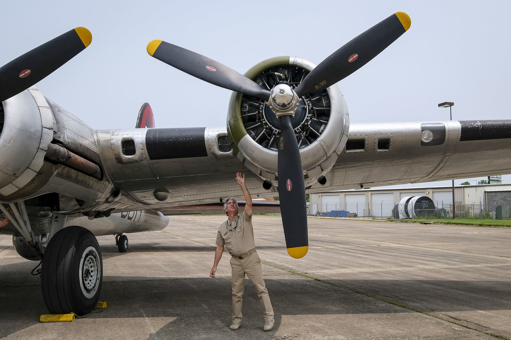 Pilot Tom Ewing checks an engine